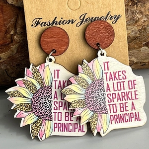 Wooden sunflower earrings with leopard print and pink Principal quote on brown card