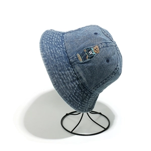 Detailed bear embroidery on light blue washed denim bucket hat for casual outdoor wear