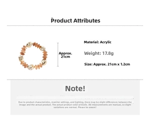 Close-up of vintage acrylic beaded bracelet with amber beads and gold textured metal accents