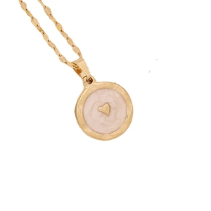 Golden owl heart necklace with pink inlay and gold heart pendant on white background