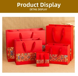 Detail display of five different sizes of traditional Chinese red paper gift bags with handles