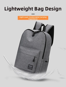 Close-up of lightweight grey fabric backpack featuring thick padded shoulder straps