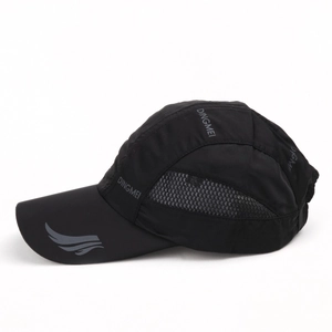 Detail view of breathable side mesh and gray wing logo on a black quick-dry baseball cap