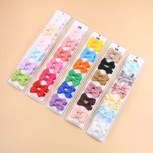 Colorful grosgrain ribbon bow hair clips set for kids on display cards in multiple colors