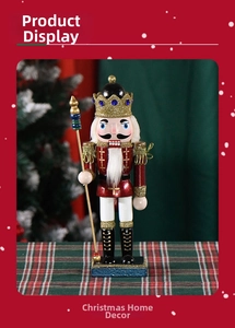 Detail of red and gold Nutcracker soldier with glitter crown and blue square base