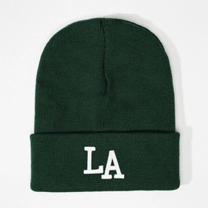 Dark green knitted beanie with white LA 3D embroidery on fold, warm casual winter hat style
