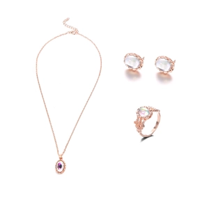 Elegant rose gold jewelry set with iridescent opal stones, necklace, earrings, and ring