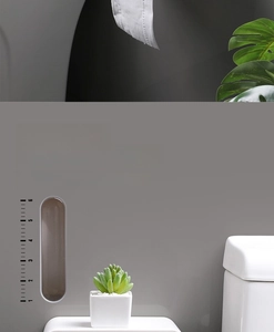 Detail view of wall-mounted tissue box with transparent window and volume scale in grey