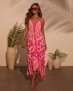 Detail of pink floral halter dress featuring a deep V-neck and boho chiffon fabric