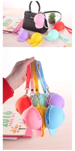 Detail of candy-colored silicone baseball cap coin purses with zipper and metal hooks