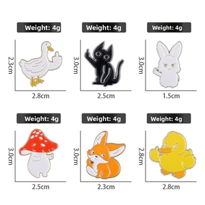 Detail view of 6 cartoon enamel pins featuring animals with a funny middle finger gesture