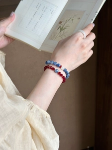 Detail of beaded agarwood and agate bracelet on wrist with elegant vintage style