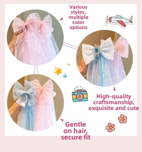 Detail view of pink and blue lace bow hair clips with long tassels and beads
