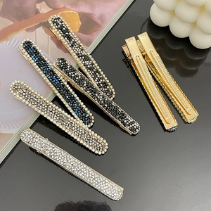 Sparkling rhinestone covered long duckbill hair clips in various colors on elegant base