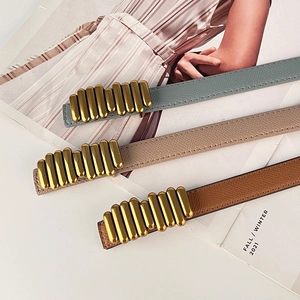 Three genuine leather caterpillar belts in blue, beige and brown with gold metal buckles