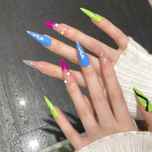 Handmade cyberpunk long stiletto press-on nails with neon colors and 3D rhinestones