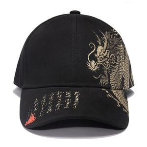 Detailed view of black baseball cap featuring golden dragon embroidery and Chinese calligraphy