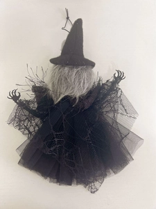 Detail of Halloween witch hanging decor with black mesh fabric and grey synthetic hair