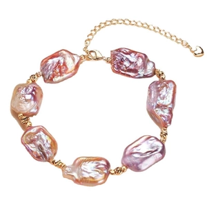 Elegant gold-plated bracelet with purple baroque pearls and a delicate heart charm