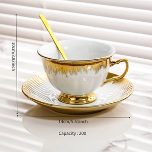 Detailed view of white ceramic coffee cup and saucer with gold trim and size specs