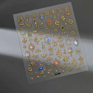 Detail showing exotic gold embossed nail stickers with stars, moon, and vintage patterns