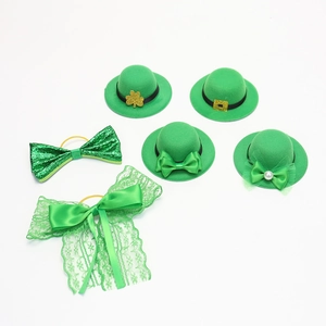 Detail view of 6-piece St. Patrick's Day green mini top hats and bowties with shamrocks
