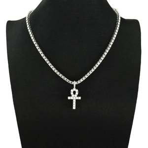 Detail of silver Ankh cross pendant with pearls on a iced out tennis chain necklace