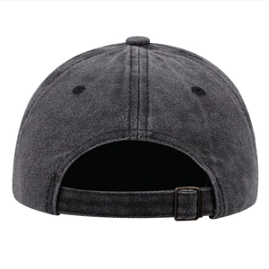 Detail of dark grey washed cotton baseball cap showing adjustable bronze metal buckle back