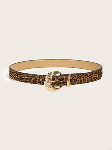 Close-up of leopard print skinny belt with a gold metal buckle on a beige background