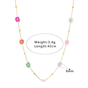 Detail view of handmade colorful beaded flower necklace with 8mm floral charms