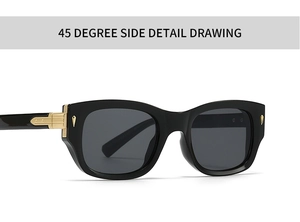 Detail view of black aviator sunglasses with gold metal hinges and dark grey lenses