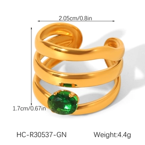 Close-up of triple-layered wave ring with green zircon and detailed dimensions