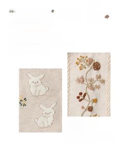 Detailed close-up of beige knitted cotton socks with cute rabbit and floral embroidery