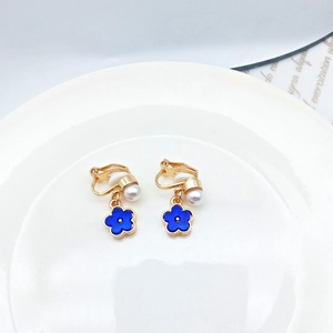 Elegant blue flower clip-on earrings with white pearl pendants and golden metal accents
