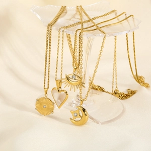 18K gold plated stainless steel necklaces with heart, sun, and celestial pendants