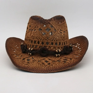 Detailed view of hollow-out woven straw hat with ethnic beaded band and brown gradient brim