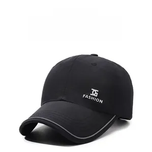 Detailed view of black quick-dry baseball cap featuring reflective brim and fashion logo