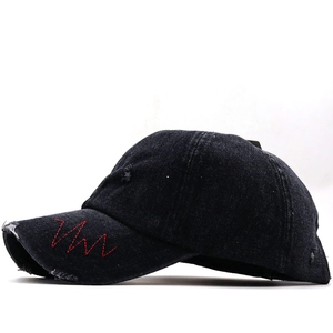 Distressed black denim baseball cap with New York embroidery and red wavy stitching
