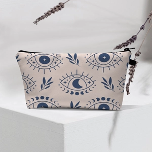 Detail of waterproof evil eye makeup bag with celestial patterns and black zipper