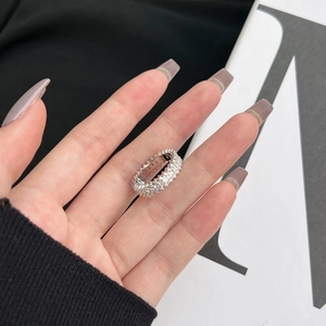 Detail of S925 sterling silver eternity ring with sparkling trapezoid zircon crystals