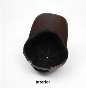 Detail view of winter leather baseball cap showing warm black lining and adjustable metal buckle