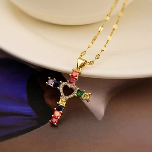 Exquisite gold-plated cross necklace with colorful gemstones and heart-shaped cutout