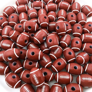 Macro view of brown American football acrylic beads with realistic white stitching detail