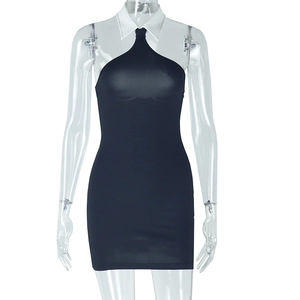 Detail of black slim fit bodycon dress featuring a white contrast halter neck collar