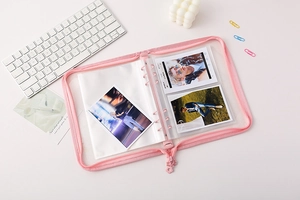 Pink zippered PVC A5 binder with clear pockets showing photo card storage detail