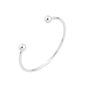 Macro view of adjustable stainless steel bangle with polished silver ball ends