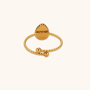 Detail of adjustable twisted rope band with water-drop base on 18K gold plated ring