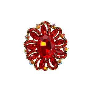 Vintage floral brooch with red oval crystal and multicolor rhinestones on gold base