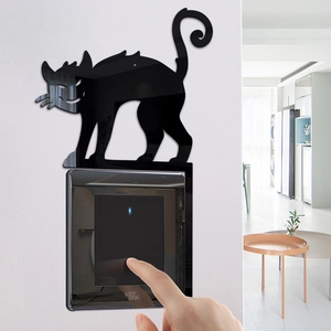 Close-up of black acrylic cat wall switch sticker for Halloween home decor