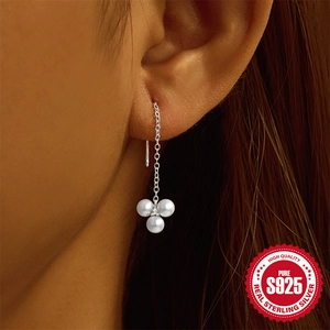 Elegant 925 sterling silver tassel earrings featuring three white pearls on a minimalist chain
